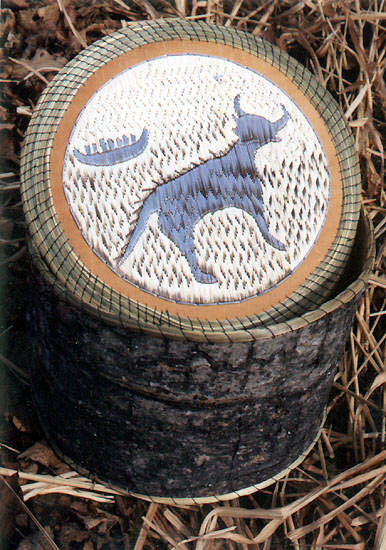 This quill box clearly shows the birch bark construction on the sides, as well as the delicate tint of the dyes used and traditional animal theme favoured by the Ojibwe.